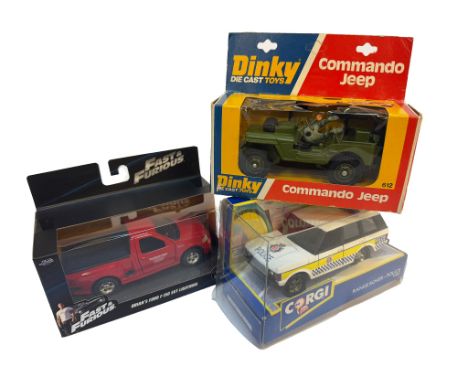 Trio of diecast vehicles including Corgi Police Land Rover, Dinky Jeep and one other. In boxes.