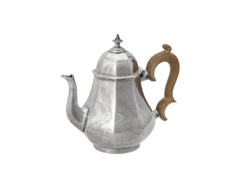 A silver octagonal baluster tea pot by R. & S. Garrard & Co., London 1911, with a bell shaped finial to the domed cover, a wo