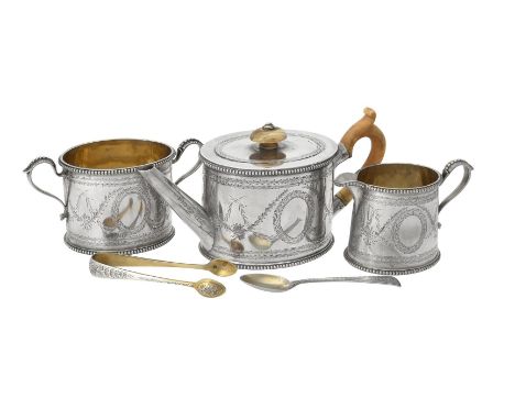 Y A Victorian silver oval three piece bachelors tea set, maker's mark E.E over E.E (not traced), London 1874, the tea pot wit