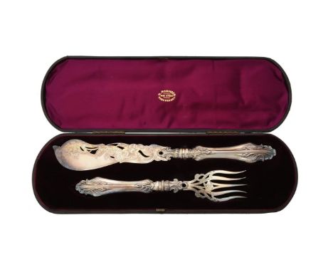 A cased pair of Victorian silver fish servers by Hilliard & Thomason, Birmingham 1854, with foliate handles, engraved with fo