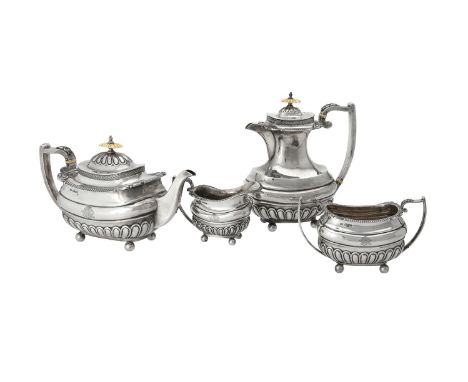 Y A silver four piece oblong baluster tea set by Walker & Hall, Sheffield 1916, the tea pot with an ivory finial to the domed