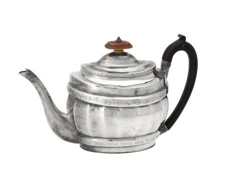 Y A George III silver oval fluted baluster tea pot by Stephen Adams II, London 1801, with an ivory finial to the domed cover,