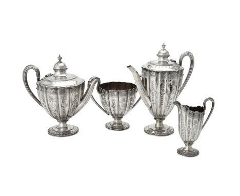 Y A Victorian silver shaped circular four piece tea set by Martin, Hall & Co., London 1874, the tea pot with an urn shaped fi