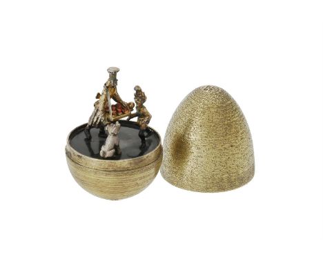 A silver gilt and enamel surprise egg by Stuart Devlin, the textured base hallmarked London 1985 and the associated cover 198