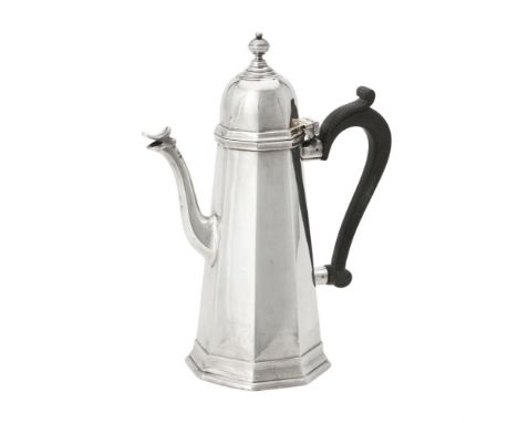 Y A silver octagonal tapering coffee pot by Goldsmiths & Silversmiths Co. Ltd., London 1918, with an orb finial to the domed 