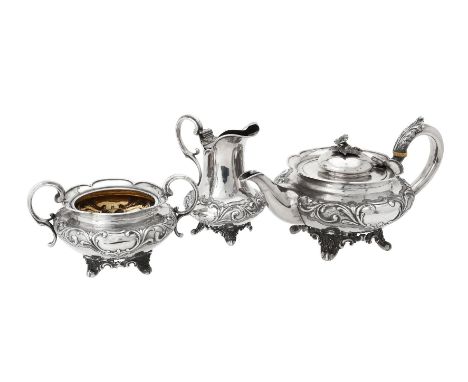 Y A Victorian silver three piece circular tea set by Benjamin Smith III, London 1840, the tea pot with a flower finial to the