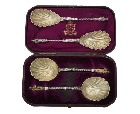A cased pair of Victorian silver apostle spoons by Martin Hall & Co., Sheffield 1873m with shell shaped bowls, 20cm (8in) lon