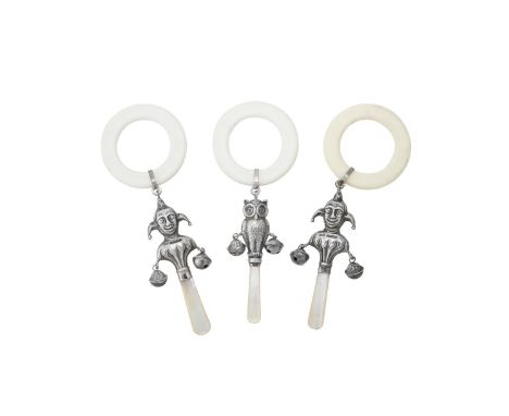 Y Two silver jester pattern baby rattles by Quarrier Ward Ltd., Birmingham 2002 and 2003, with plastic rings and mother of pe