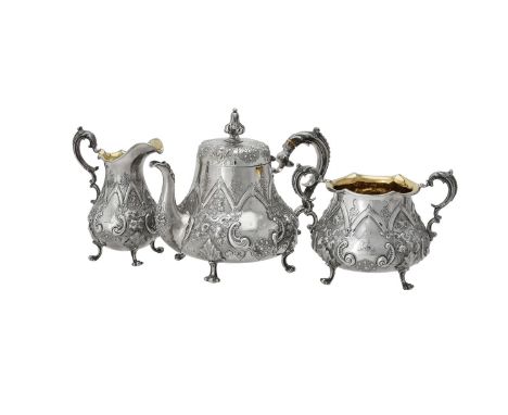 Y A Victorian silver three piece baluster tea set by Daniel & Charles Houle, London 1863, the tea pot with a quatrefoil finia