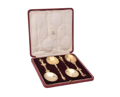 A cased set of four matched silver gilt apostle spoons, three by D. & J. Welby, London 1925 and one by Pairpoint Brothers, Lo