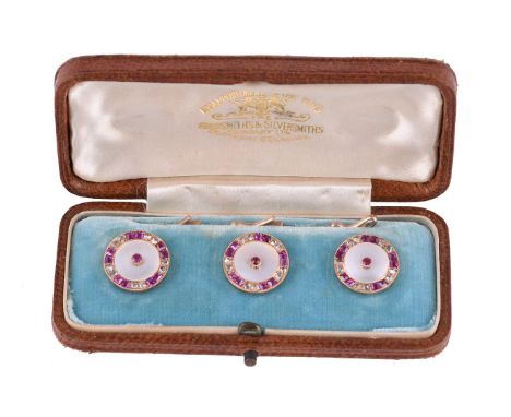 Y A set of three early 20th century ruby, diamond and mother of pearl buttons, each button with a circular mother of pearl pa