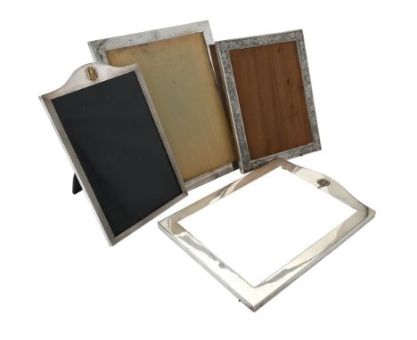 A silver mounted shaped rectangular photo frame by Barker Brothers Silver Ltd., Birmingham 1951, applied with a German state 