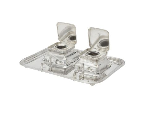 A silver oblong ink stand by Asprey & Co. Ltd., Birmingham 1935, with a reeded border, two square inkwells with canted corner