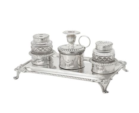 A George III silver rectangular inkstand by John Roberts & Co., Sheffield 1811, with a gadrooned border, two pen trays, a cen