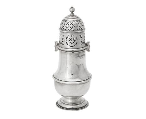 A silver baluster sugar castor by Carrington & Co., London 1929, with a ball finial to the pierced domed cover and on a circu