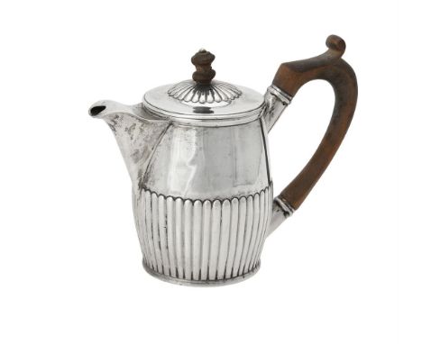 A George III silver bachelors tea pot, maker's mark obscured, London 1805, with a wood finial to the cover and a loop handle,