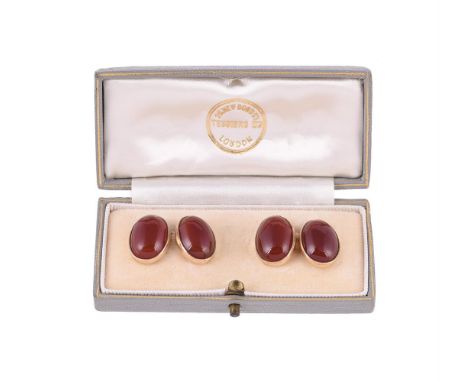 A pair of 1970s cabochon cornelian cufflinks by Cropp & Farr, the oval cabochon cornelian within collet settings, with belche