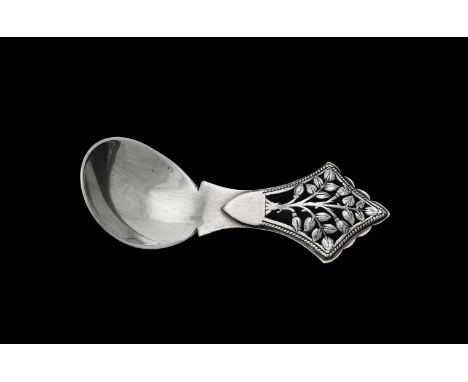 An Arts & Crafts silver tree of life pattern caddy spoon by Henry George Murphy, London 1933, 9.5cm (3 3/4in) long, 27g (0.85