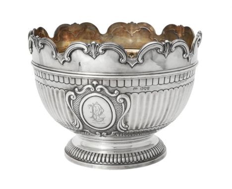 A Victorian silver shaped circular pedestal punch bowl by Sibray, Hall & Co., London 1895, with a C-scroll border, a half flu