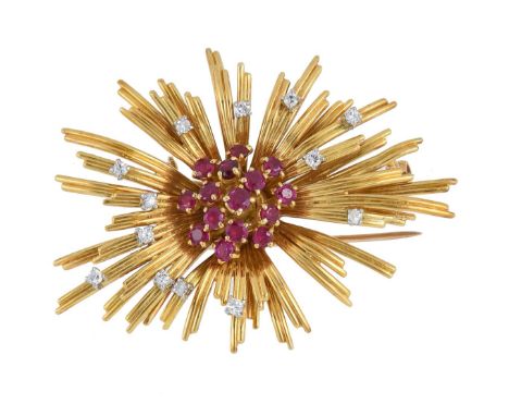 A late 1950s ruby and diamond abstract brooch by Ben Rosenfeld, the central ruby cluster to radiating striated bars set with 