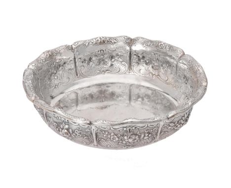 A Victorian silver shaped circular bowl by Robert Hennell III, London 1842, the lobed body with chased floral sprays and scro