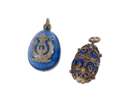 Two enamelled Soviet Russian eggs, one decorated with a crowned lyre within a wreath, with blue enamel, stamped 925 with Russ