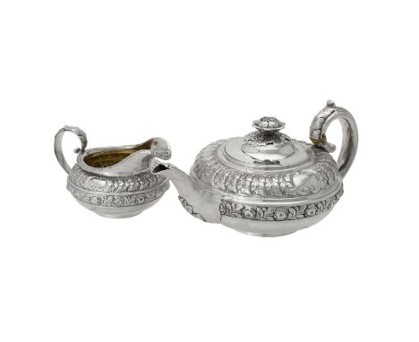 Y A George IV silver circular tea pot and cream jug by Rebecca Emes & Edward Barnard I, London 1822 and 1823, the tea pot wit