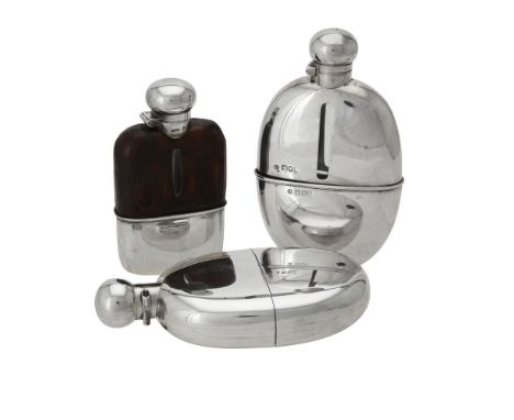 An Edwardian silver oval spirit flask by Army & Navy Cooperative Society Ltd., London 1902, with a pull off cup, 16cm (6 1/4i