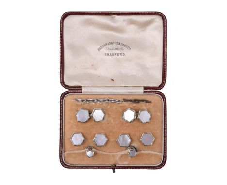 Y A 1930s mother of pearl dress set, the cufflinks with octagonal mother of pearl panels within white gold borders, with belc