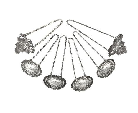 Four William IV silver shaped oval decanter labels by James Collins, Birmingham 1835 (1) and 1836 (3), with foliate and C-scr