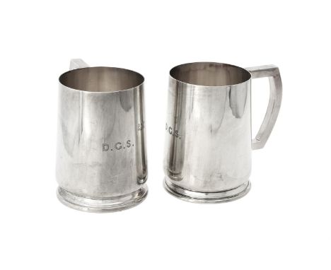 A pair of silver pint mugs by William Suckling Ltd., Birmingham 1946, with loop handles, engraved D.G.S., on circular moulded