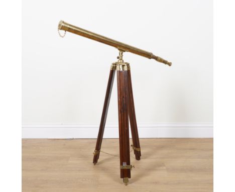 A BRASS ADJUSTABLE LIBRARY TELESCOPE ON TRIPOD STAND (2)20th Century
Mounted on mahogany and hardwood stand with extending le