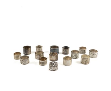 TWO SILVER NAPKIN RINGS AND THIRTEEN ASIAN NAPKIN RINGS INCLUDING CHINESE EXAMPLES (15)Comprising; a triangular example engra