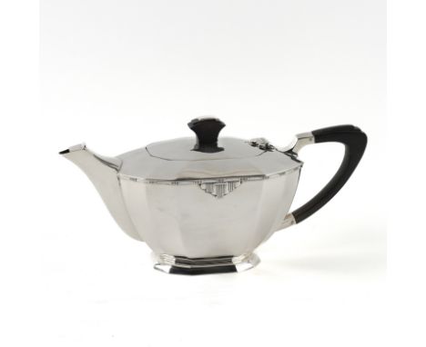 A SILVER TEAPOTOf Art Deco panel form design, having black composition fittings, Sheffield 1947, gross weight 704 grams