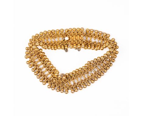 A GOLD MULTIPLE LINK BRACELETDecorated with beaded edges, on a snap clasp, fitted with a safety chain, unmarked, weight 36 gr