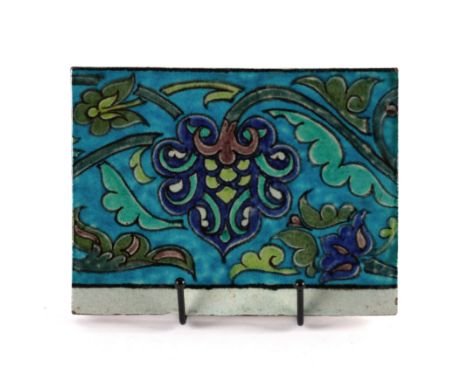 A WILLIAM DE MORGAN RECTANGULAR TILE1880's Painted with Persian flowers and foliage, impressed Merton Abbey mark, 15.25cm by 