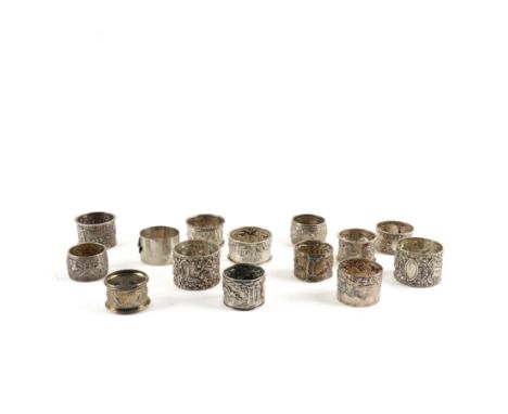 FOURTEEN HUNTING AND ANIMAL THEMED SILVER NAPKIN RINGS (14)Including a Scottish pair, decorated with game birds, Glasgow 1893