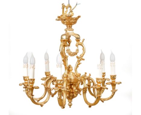 AN ITALIAN ROCOCO STYLE GILT-METAL EIGHT LIGHT CHANDELIERLate 20th Century 
With acanthus scroll open frame and down-swept sc