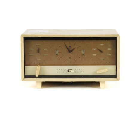 E.K COLE: A MID-20TH CENTURY CREAM BAKELITE RADIO ALARM CLOCK31cm wide