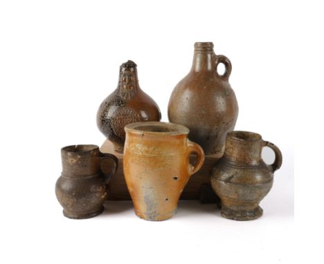 A GERMAN BROWN STONEWARE MUG (5)Probably Raeren, circa 16th century Bulbous body with cylindrical neck and thumbed base, 15.5