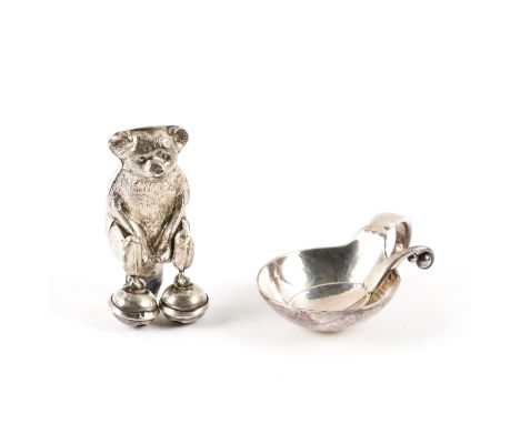 A GEORG JENSEN STERLING SALT AND SPOON AND A SILVER RATTLE FINIAL (3)The circular salt with a loop form handle, detailed Geor