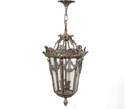 A LOUIS XVI STYLE SILVERED METAL HEXAGONAL HANGING LANTERNLate 20th Century
Enclosing three light fittings, 72cm high