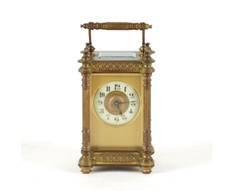 A FRENCH GILT-BRASS CORNICHE CARRIAGE CLOCK TIMEPIECEEarly 20th Century 
The case with diaper frieze, the dial with Arabic ho