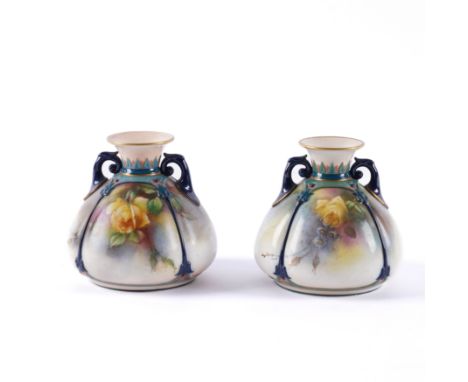 A PAIR OF SMALL HADLEY'S WORCESTER TWO-HANDLED VASES (2)Early 20th century Of squat form, the panelled sides painted with ros