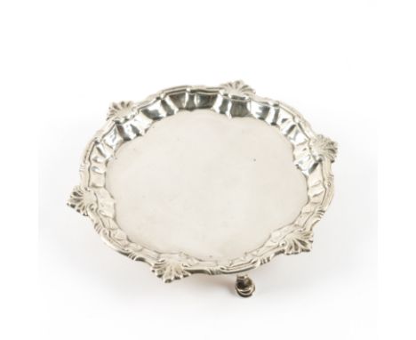 A LATE GEORGE II SILVER SHAPED CIRCULAR WAITERHaving a shaped rim in the Chippendale style, raised on three pad feet, diamete