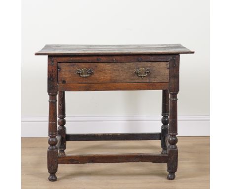 A 17TH CENTURY OAK SINGLE DRAWER SIDE TABLEOn turned supports, 85cm wide; 59cm deep; 69cm highMiddle section of the top has a