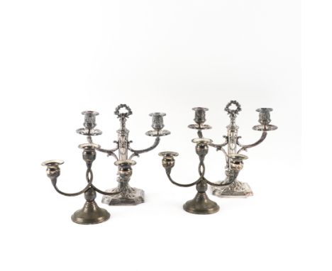 TWO PAIRS OF CANDELABRA (4)Comprising; a three light pair, each raised on a circular foot, detailed Sterling, reinforced with