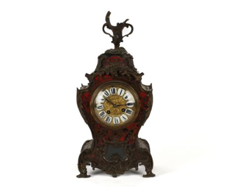 A FRENCH ROCOCO REVIVAL TORTOISESHELL AND BRASS INLAID  ‘BOULLE’ MANTEL CLOCKLate 19th Century 
With gilt-metal mounts, the c