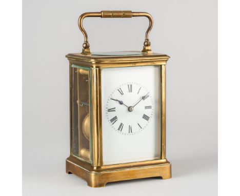 A FRENCH BRASS STRIKING CARRIAGE CLOCKCirca 1890
In a Corniche case with oval glass panel to the top, the twin train movement