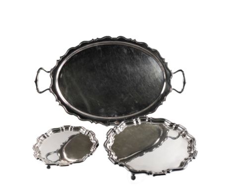 A PLATED TRAY AND TWO PLATED SALVERS (3)The twin handled shaped oval tray length including handles 62.5cm, the two salvers of